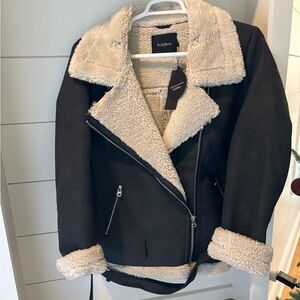 With Black aviator jacket